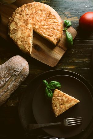Cooking ingredients around pie on table