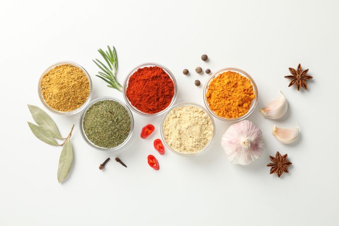Top view of colorful spices in bowls