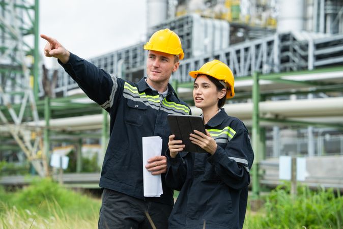 Engineer worker checking project at petrochemical factory or refinery oil plant industrial.