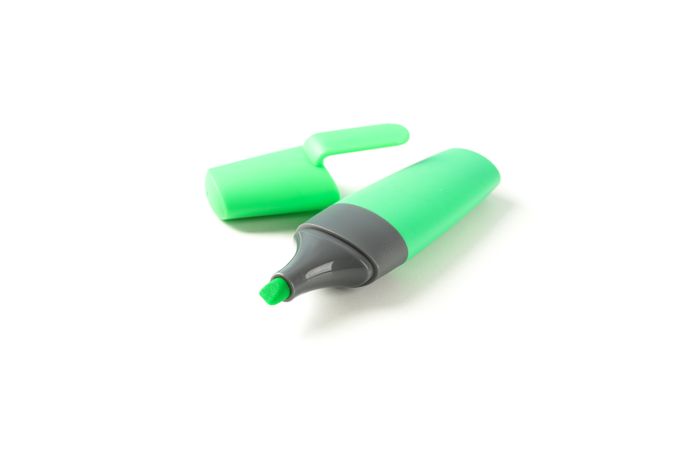 Color office highlighter isolated on plain background