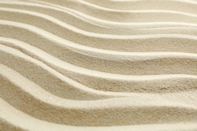 Seamless sand on a whole background, space for text and closeup. Summer vacation backdrop