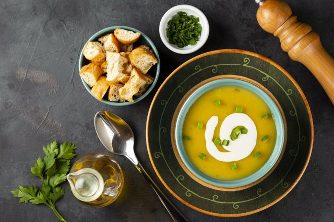 Bowl with pumpkin soup on the table.
