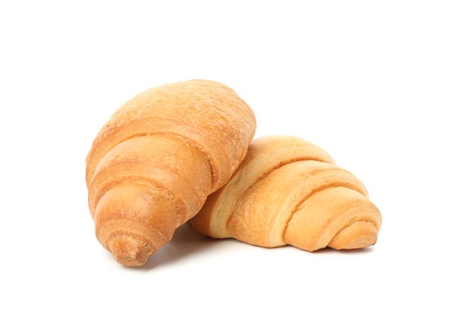 Two croissants isolated on plain background