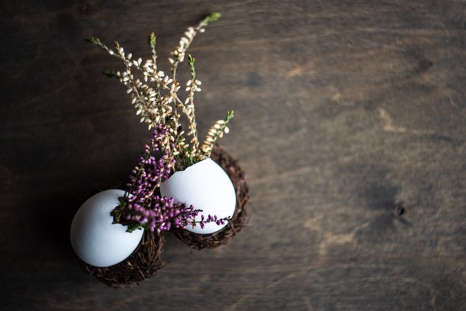 Heather in decorative eggs on wooden table