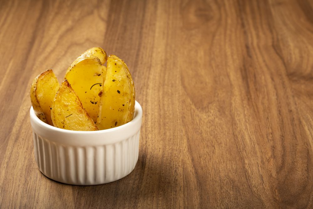 Roasted potatoes with rosemary on the plate.