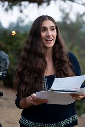 Female director looking up from script giving feedback