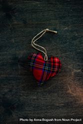 Valentine's day concept of tartan heart decorations on wooden table 5zrrRn