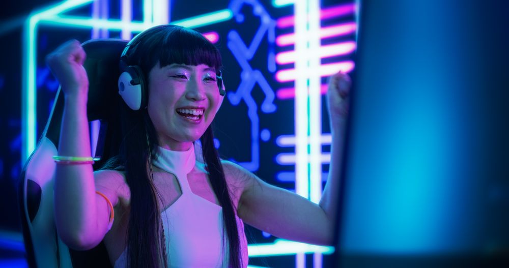 Japanese Online Gamer Playing a Video Game in a Futuristic Cyberpunk Room.