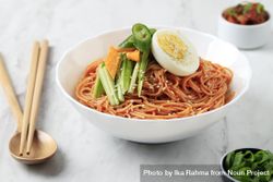 Korean noodle dish plates with boiled egg and fresh vegetables 41zpDb
