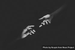 Grayscale photo of two hands about to hold each other 4jAEz5