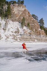Woman skating on frozen river
