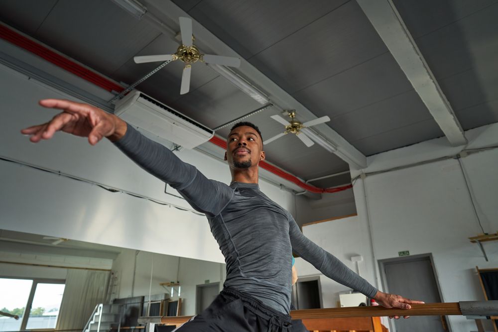 dancer in a warm-up and dancing in a ballet class