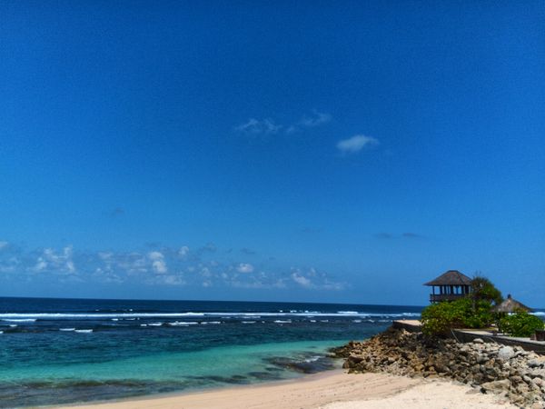 Beach view with blue water and clear sky