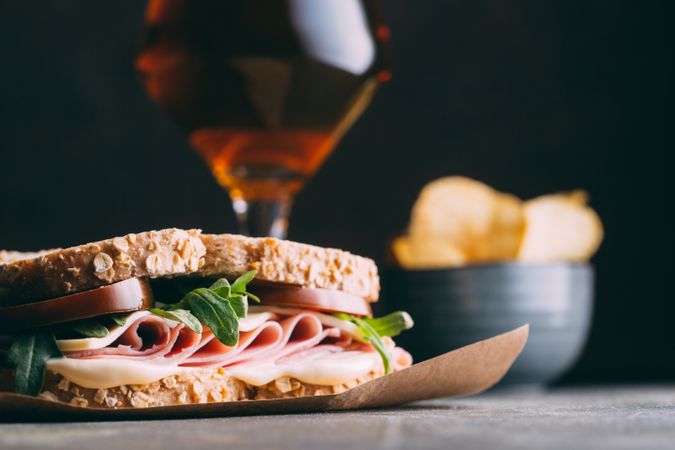 Delicious sandwich with ham, cheese, lettuce and tomato
