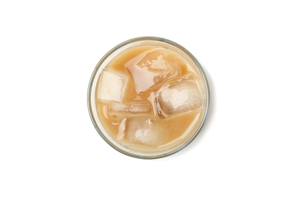 Glass of ice coffee isolated on plain background