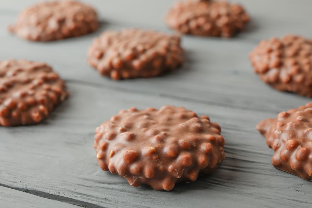Flat lay composition with chocolate cookies on wooden background