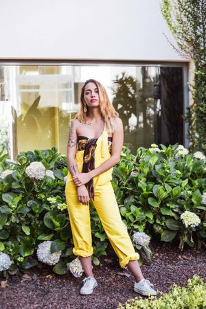 trendy woman standing in garden