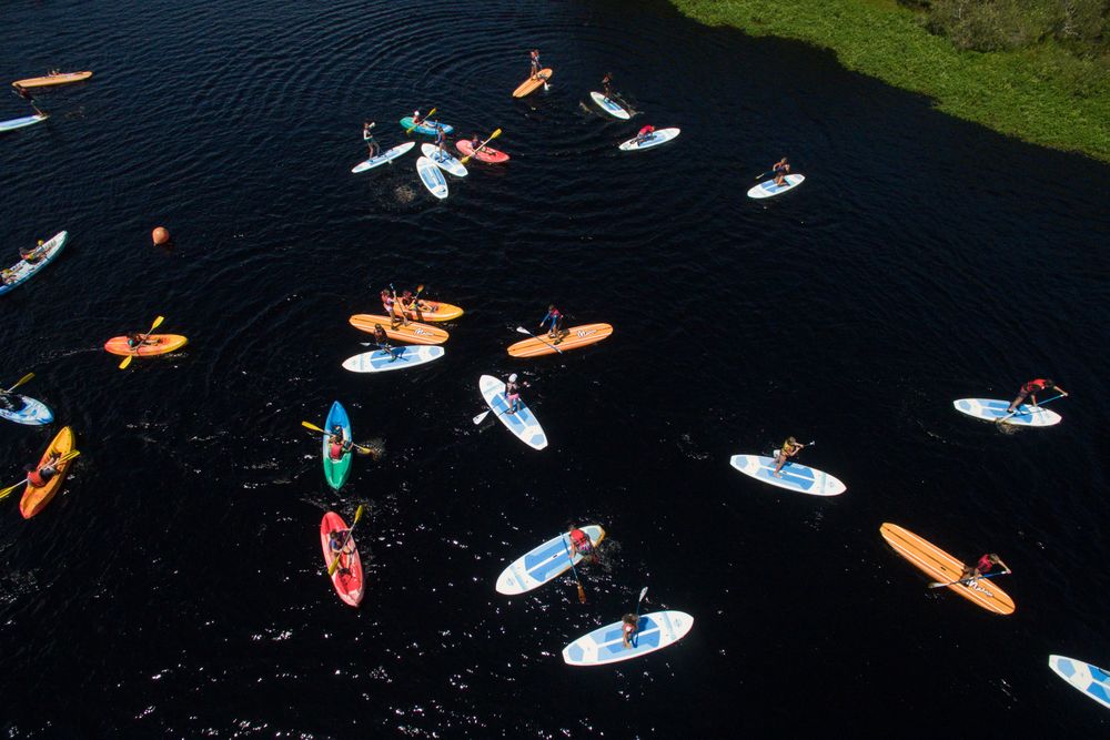 Aerial view of people riding on boat on water