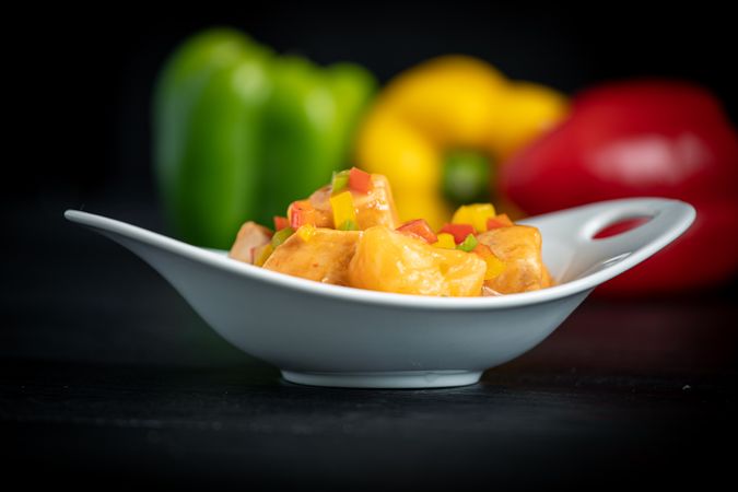 Juicy Marmitako dashi with peppers on table