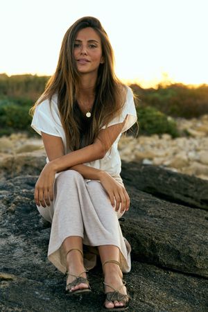 young woman posing on rock