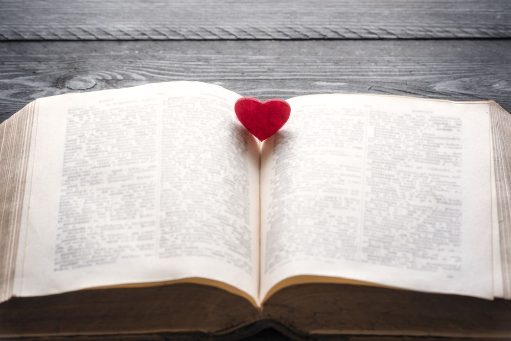 Red heart on an open book