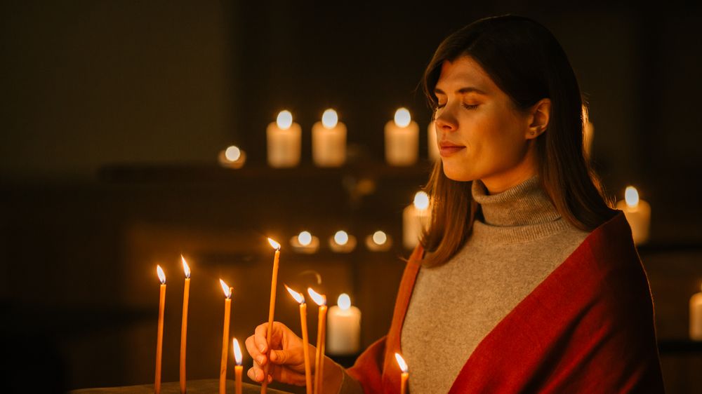Female Parishioner hoping and Wishing with Closed Eyes keeping her heart Pure with Prayers