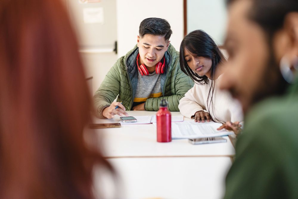 Students in group study with their notes
