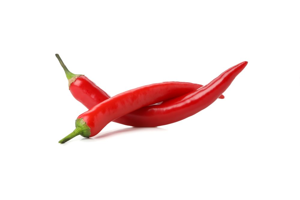 Tasty red chilli peppers isolated on blank background