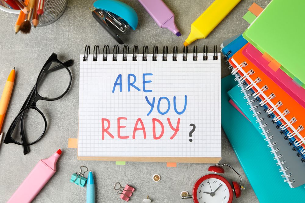 Top view of open notebook with the words “Are you ready”