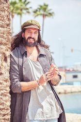 Smiling adult man near pier