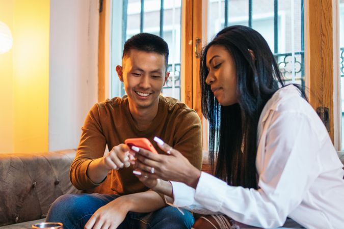 Interracial couple dating using smartphone