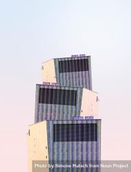 Three irregular buildings against a bright sky 5rok14