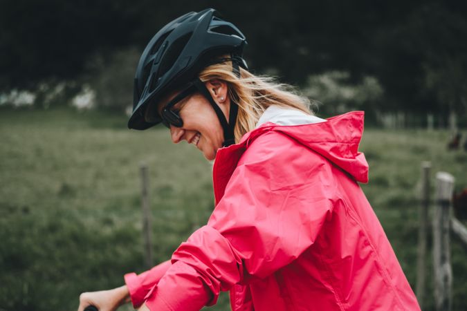 Smiling female riding bicycle