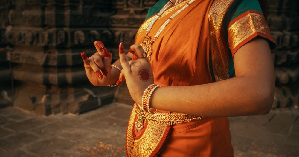 Portrait of An Indian Female Dancer Doing Symbolic Gestures Conveying Different Messages in Folkloric Dance.