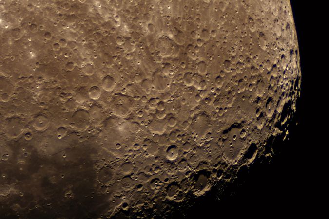 Zoomed-in view of lunar terrain displaying countless impact craters