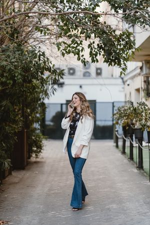 Woman talking phone on street