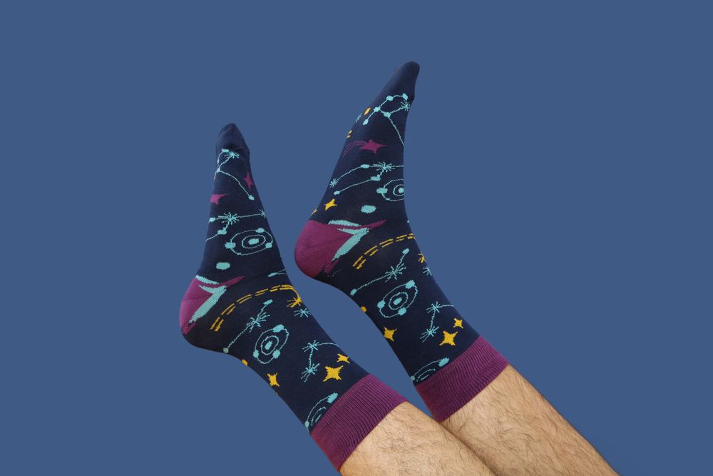 Colored socks with a print on men's feet.