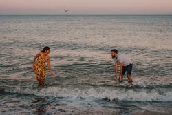 Active lovely couple having fun in foamy water