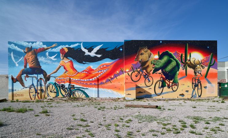 Colorful “Epic Rides” wall mural painted on building in Tucson