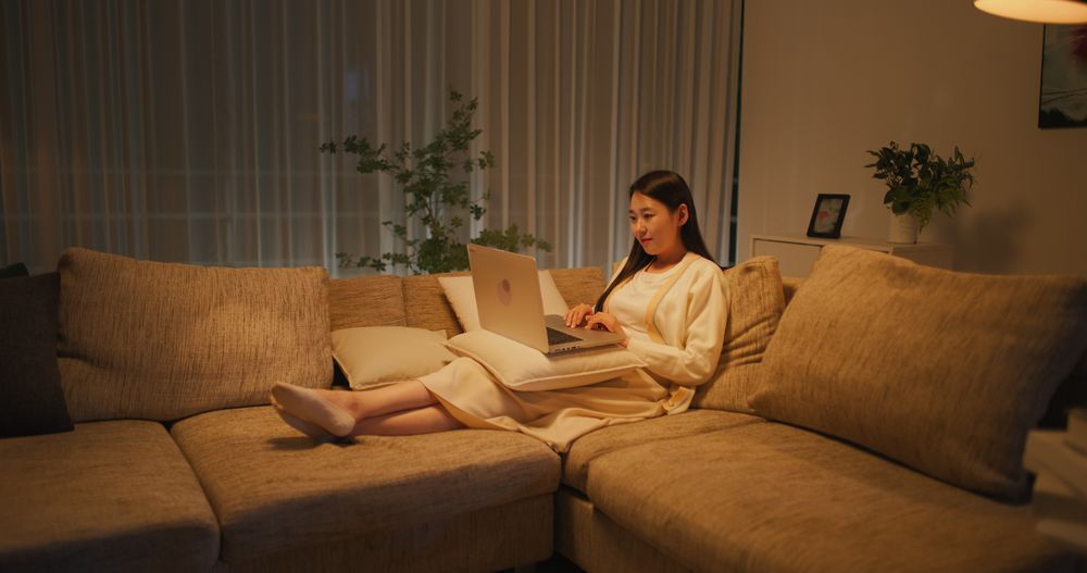 Portrait of a Korean Female Focused on Virtual Work from Home Late at Night