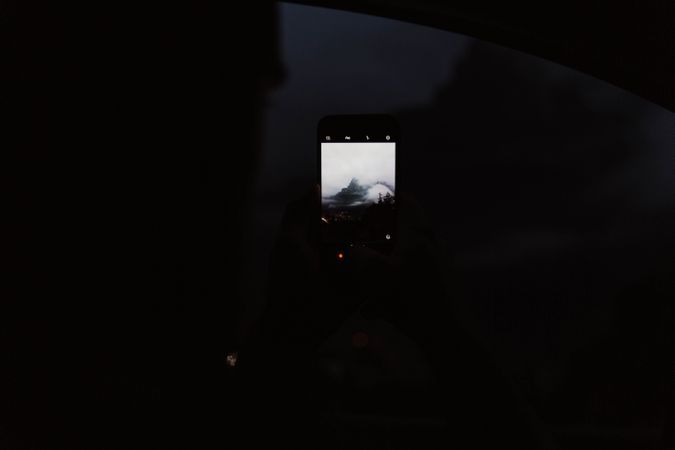 Powerful mountains and cloudy sky view from window of car