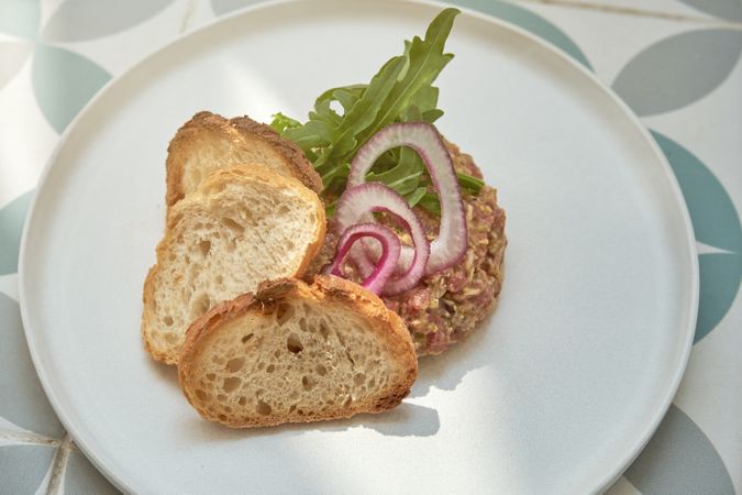 Delicious steak tartare served on white plate