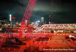 Red metal crane near city during night time 4NJrl4