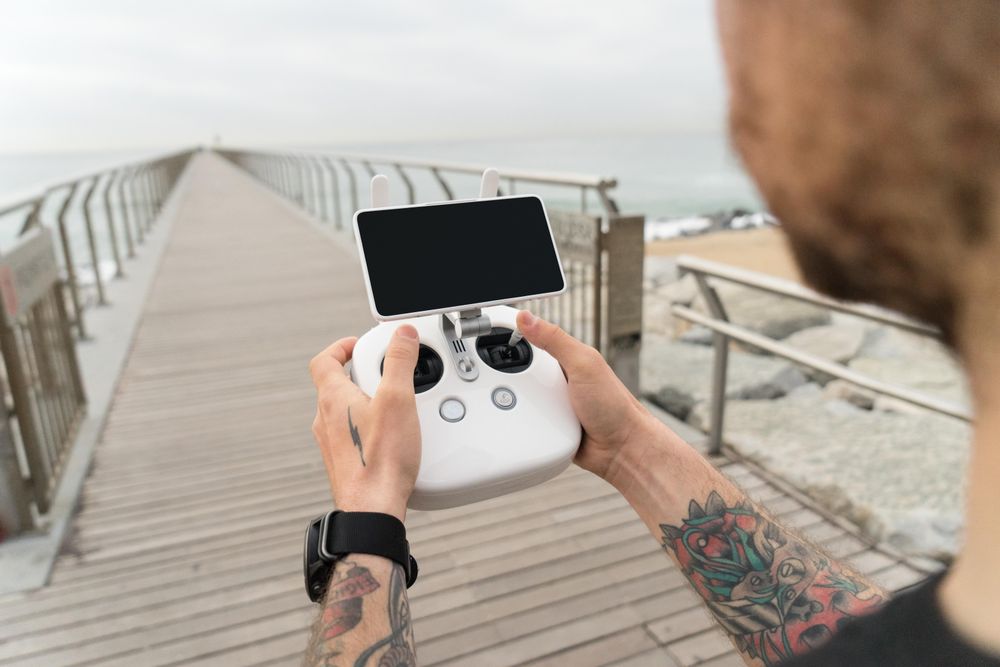 Man with remote for drone on film set