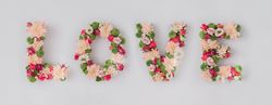 Word “LOVE” made of various flowers