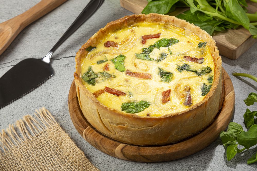 Spinach quiche with onion and bacon.