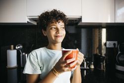 Girl drinking a cup of milk