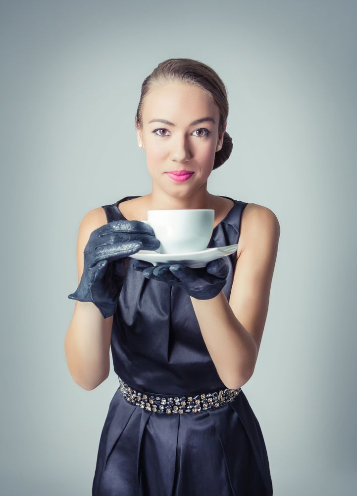 Vintage model with coffee cup