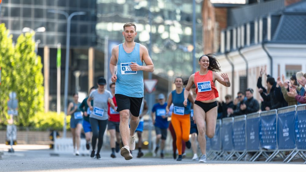 Happy Group of People Participating in a City Marathon.