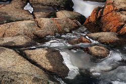 Scenic ice covered mountain river in daylight